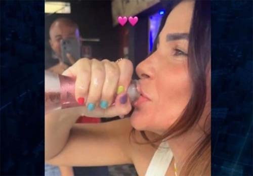 Primeira-dama do tráfico abre champagne na frente de presídio após ser solta no Rio