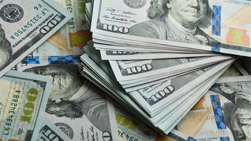 Dólar vira e cai à mínima de R$ 5,0478 com alívio em juro de Treasuries e DXY