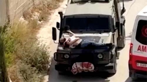 Cisjordânia: Exército israelense amarra palestino ferido ao capô de um veículo e provoca indignação